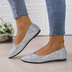 Women's glitter pointed toe flats from Arenzza featuring a shiny, sparkling surface and sleek pointed toe design.