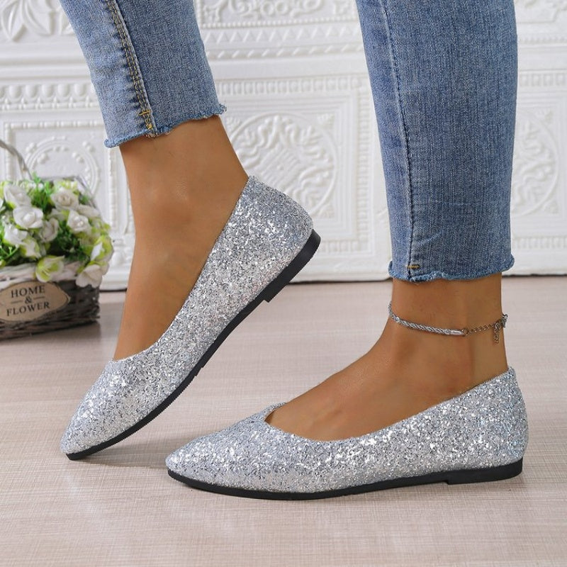 Women's glitter pointed toe flats from Arenzza featuring a shiny, sparkling surface and sleek pointed toe design.
