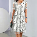 Aarenza women's floral print chiffon dress with elegant design, featuring a flowing fabric and vibrant floral pattern.