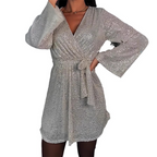 A women's sparkly V-neck long sleeve dress with waist tie by Arenzza, featuring shimmering fabric and elegant fit.