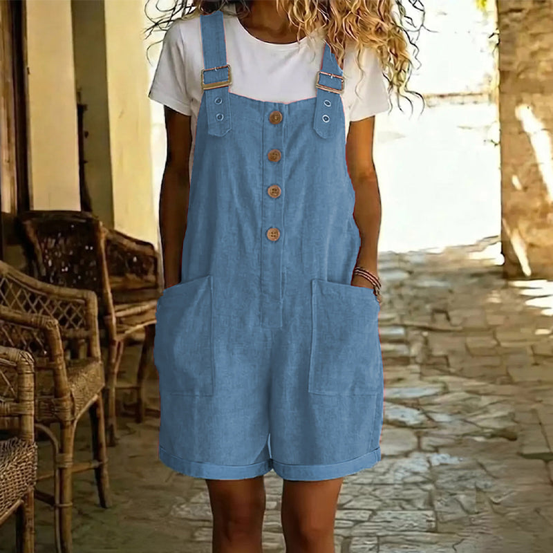 Aarenza retro solid color romper with adjustable straps, featuring a sleeveless design and relaxed fit, displayed on a hanger.