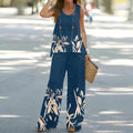 A woman wearing a sleeveless top and wide-leg pants set by Arenzza, featuring a stylish, casual outfit with neutral tones.