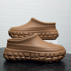 A pair of stylish Arenzza non-slip closed-toe clogs with a sleek design, ideal for comfortable and safe footwear.