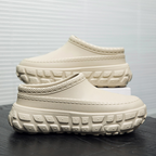 A pair of stylish Arenzza non-slip closed toe clogs with a sleek design, perfect for comfortable everyday wear.