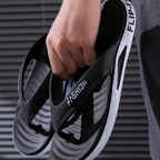 A pair of Arenzza men's sporty flip flops with ultra-soft soles, suitable for beach, gym, and daily wear.
