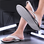 A pair of Arenzza men's sporty flip flops with ultra-soft soles, ideal for beach, gym, and daily casual wear.