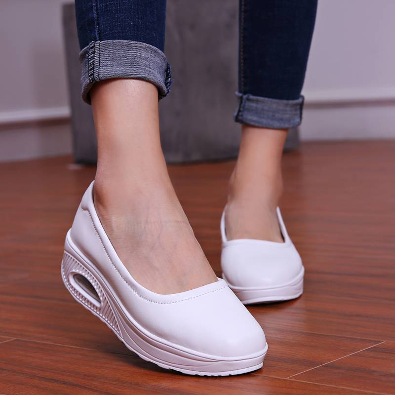 A pair of women's breathable nursing shoes from Arenzza, showcasing comfortable slip-on design and breathable fabric in neutral color.