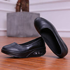 A pair of women's breathable nursing shoes by Arenzza, featuring comfortable design with breathable fabric and supportive soles.