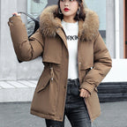 A woman wearing a thick, loose hooded fleece parka coat by Arenzza, ideal for winter warmth and outdoor comfort.