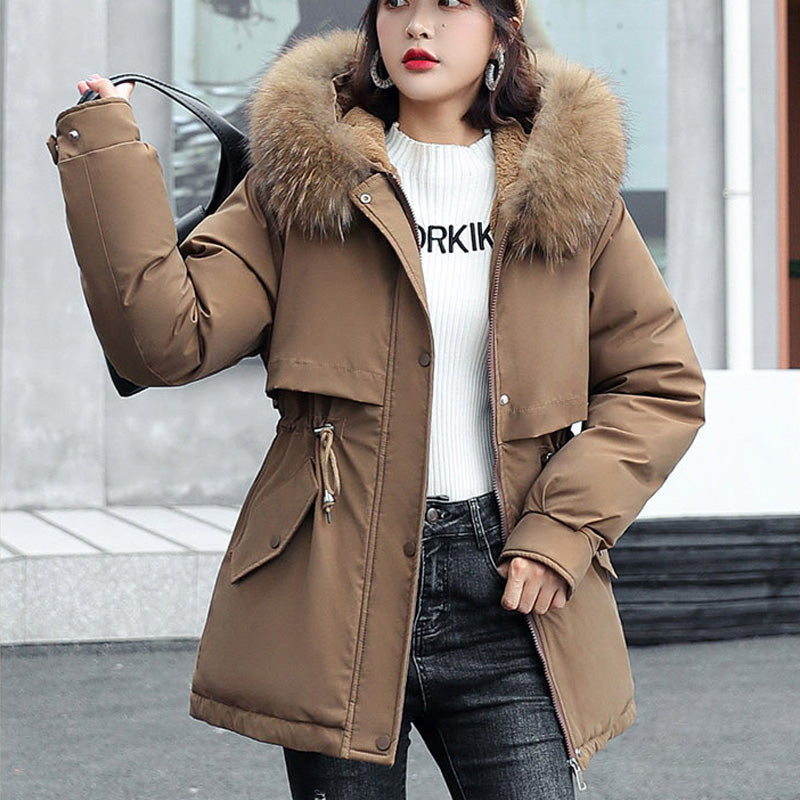 A woman wearing a thick, loose hooded fleece parka coat by Arenzza, ideal for winter warmth and outdoor comfort.