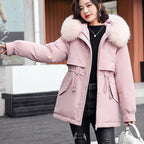 A woman wearing a thick, loose hooded fleece winter parka coat by Arenzza, featuring a cozy synthetic fleece fabric and relaxed fit.