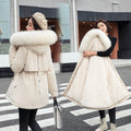 A woman wearing a thickened fleece hooded winter parka coat by Arenzza, featuring a loose fit and cozy synthetic fleece material.