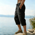 Men's linen blend cargo capri pants by Arenzza, casual lightweight trousers with multiple pockets, in neutral color.