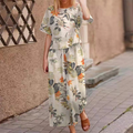 A woman wearing a loose print top and matching pants from Arenzza, showcasing a stylish 2-piece clothing set.