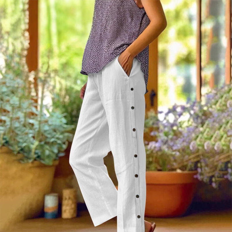 A pair of Arenzza casual solid-color loose-fit cropped pants with side buttons, shown on a model against a neutral background.