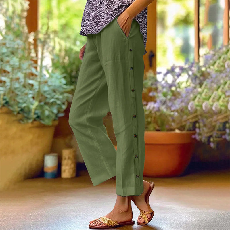 A pair of Arenzza casual solid-color loose-fit cropped pants with side buttons, displayed flat showing the front design.