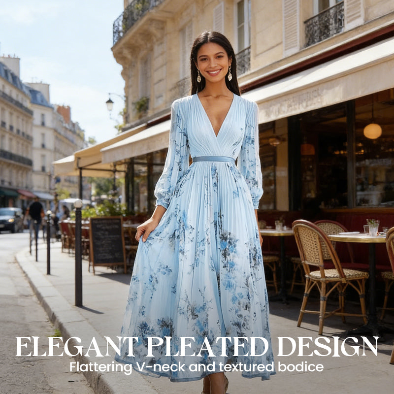 A woman wearing an elegant V-neck floral pleated maxi dress by Arenzza, featuring a flowing silhouette and vibrant floral pattern.