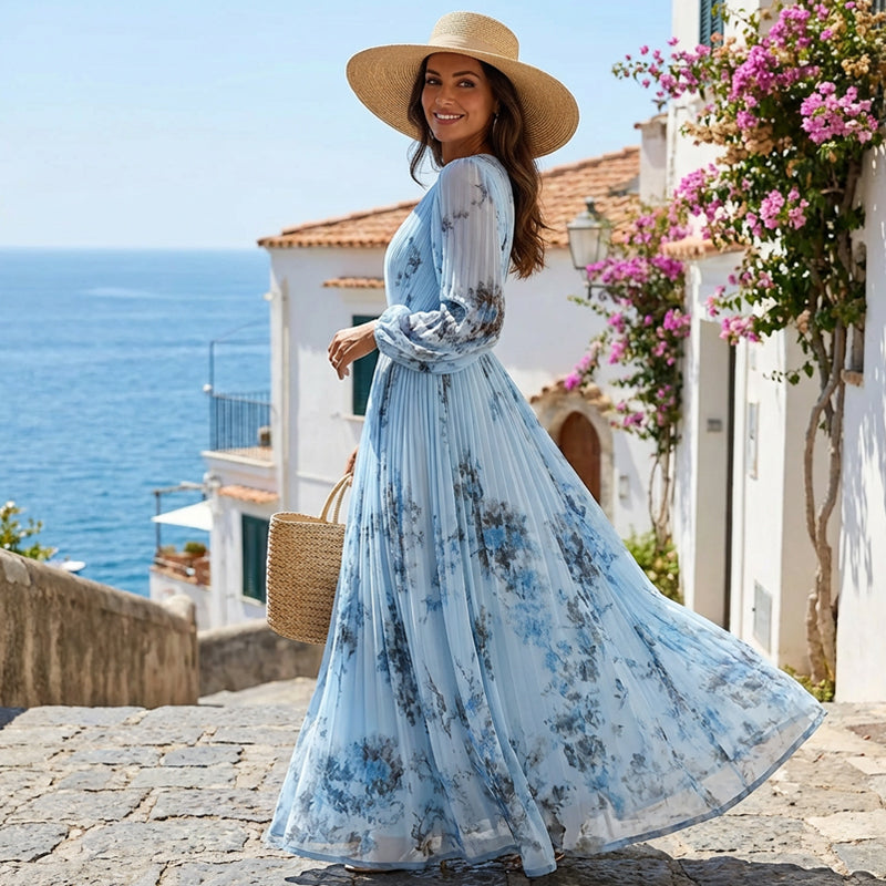 Aarenza floral pleated maxi dress with a V-neckline in vibrant colors, worn by a model showcasing its elegant style.
