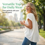 A white Arenzza flowy short sleeve top with inverted pleat back, lightweight fabric and relaxed fit, displayed on a hanger.