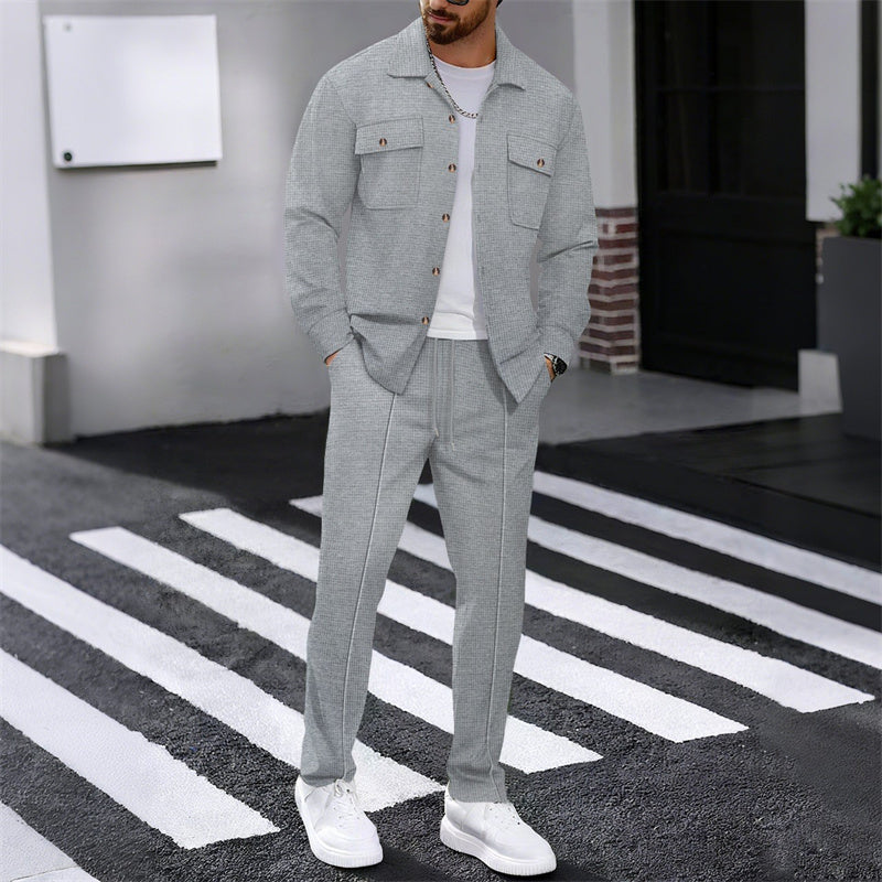 A men's waffle button-down jacket and pants set by Arenzza, featuring a casual, textured fabric in neutral tones.