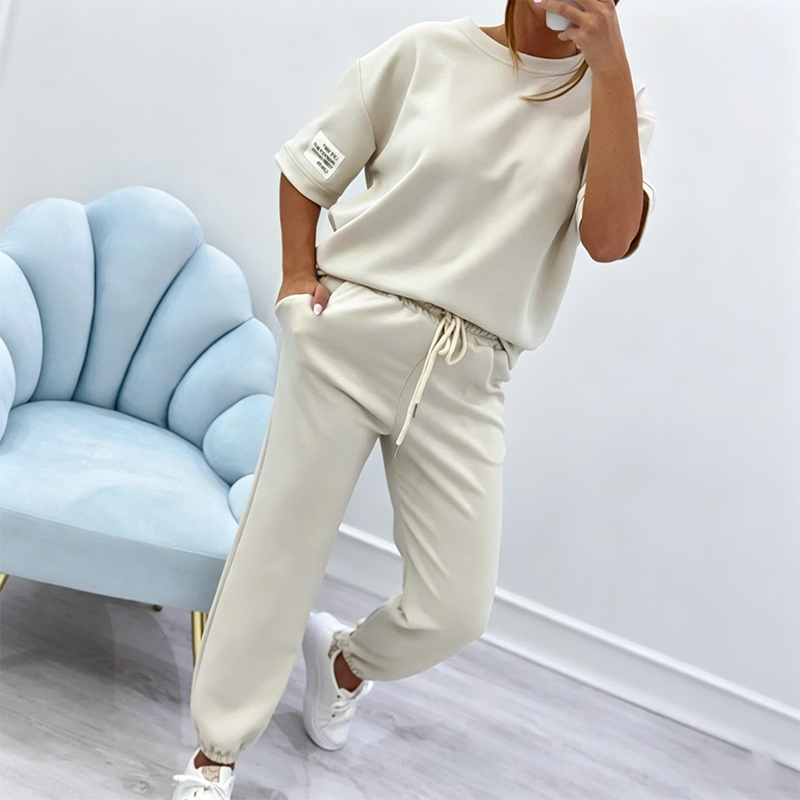 Arenzza women's casual short sleeve top and pants set displayed on a hanger, featuring a comfortable, stylish clothing ensemble.