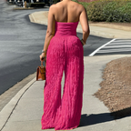 Aarenza strapless crinkle wide-leg jumpsuit in lightweight fabric, displayed on a hanger with a neutral background.