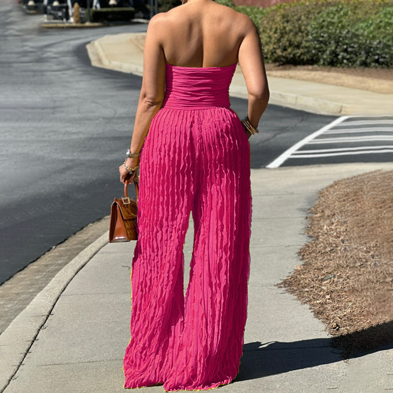 Aarenza strapless crinkle wide-leg jumpsuit in lightweight fabric, displayed on a hanger with a neutral background.