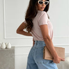 A women's solid V-neck short sleeve top by Arenzza, featuring a classic fit and lightweight fabric, displayed on a hanger.