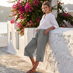 Women's casual cropped pants from Arenzza featuring button detail, styled with a relaxed fit and neutral fabric.