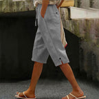 A pair of women’s casual cropped pants with button detail from Arenzza, featuring a relaxed fit and stylish design.