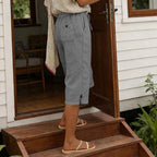 A pair of women's cropped casual pants by Arenzza featuring button details, displayed on a neutral background.