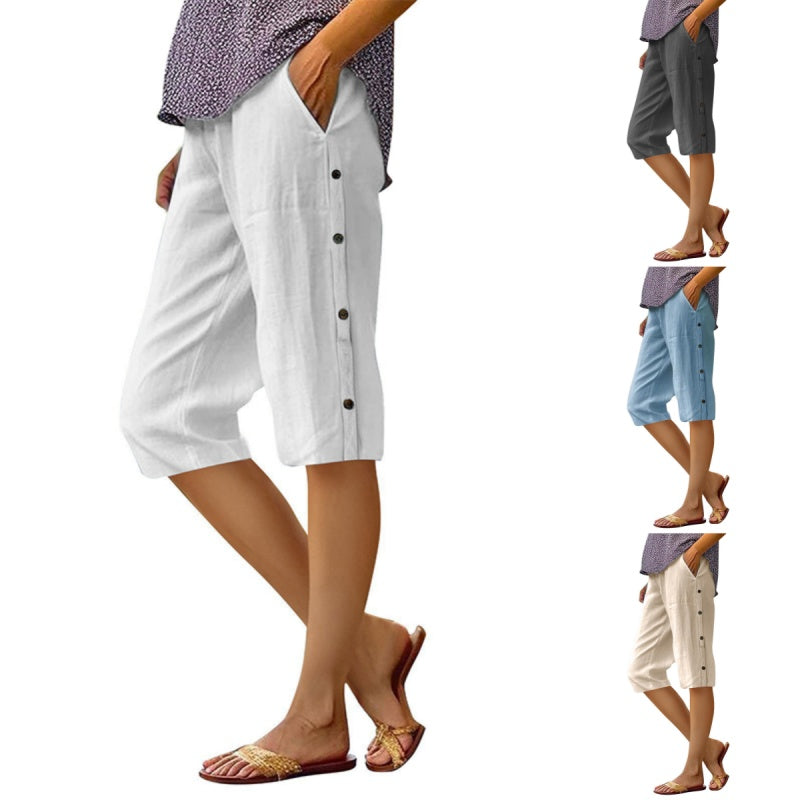 A pair of women’s loose cotton linen breathable Capri pants by Arenzza, shown laid flat, highlighting their relaxed fit and natural fabric.