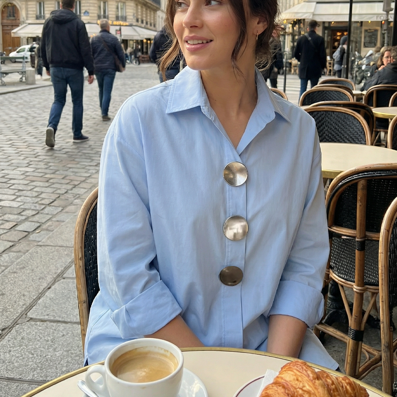 Arenzza women's oversized button-down shirt with statement buttons, showing the relaxed fit and stylish design in a natural pose.