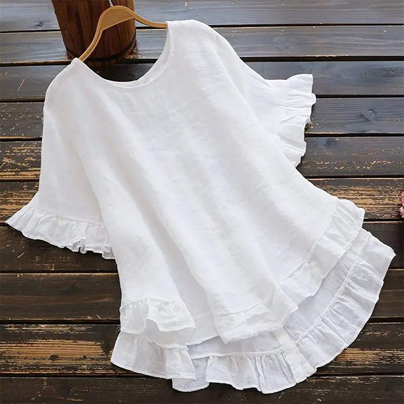 Aarenza women's round neck ruffle blouse in soft fabric, featuring ruffle details along the neckline and a relaxed fit.