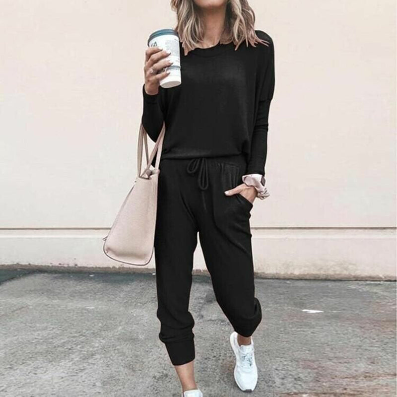 Women’s solid color casual set by Arenzza featuring a long sleeve top and drawstring pants, perfect for comfortable everyday wear.