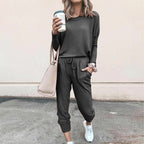Women’s solid color casual long sleeve top and drawstring pants set by Arenzza, featuring a comfortable, stylish loungewear outfit.