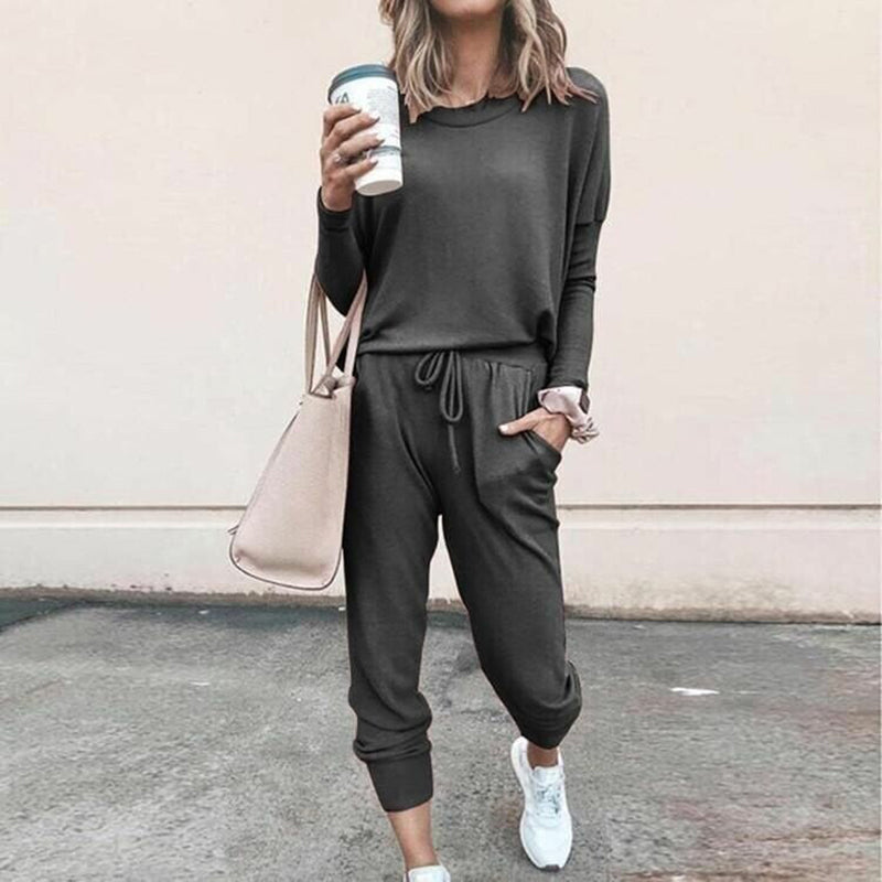 Women’s solid color casual long sleeve top and drawstring pants set by Arenzza, featuring a comfortable, stylish loungewear outfit.