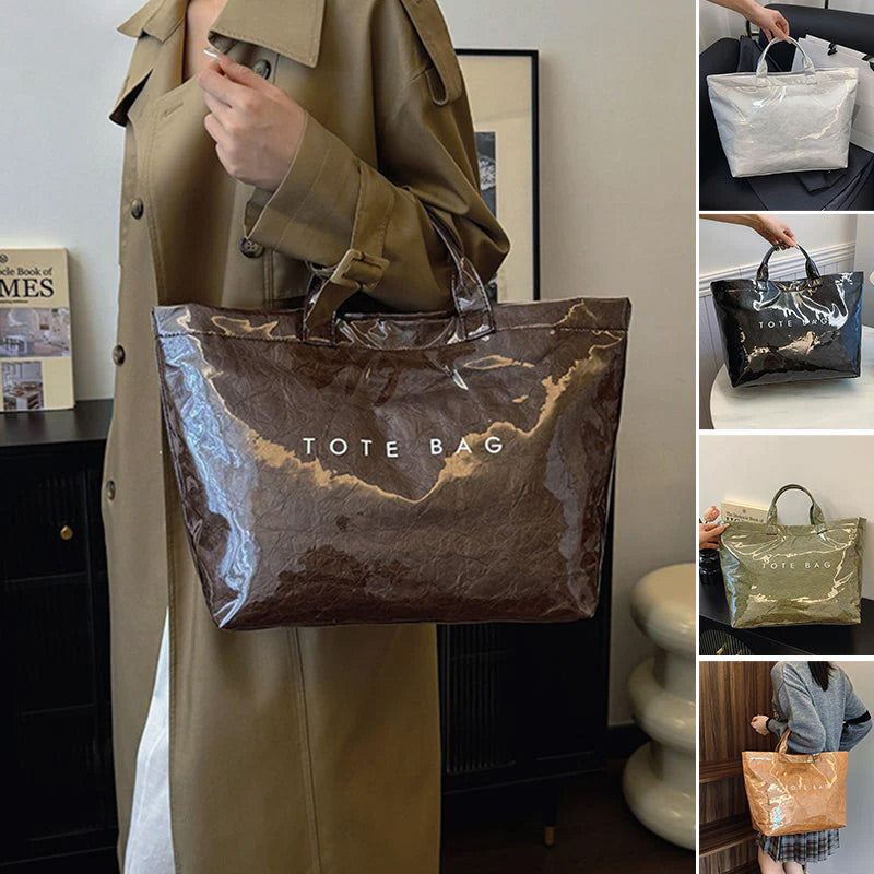 Women's retro letters print tote bag by Arenzza featuring a casual, stylish design with bold letter graphics and sturdy handles.