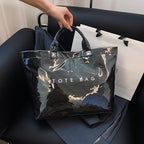 Women's retro letters print tote bag by Arenzza featuring a stylish, colorful design on durable fabric.