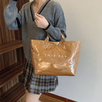Women's retro letters print tote bag by Arenzza with bold, colorful letter designs on a spacious fabric bag.