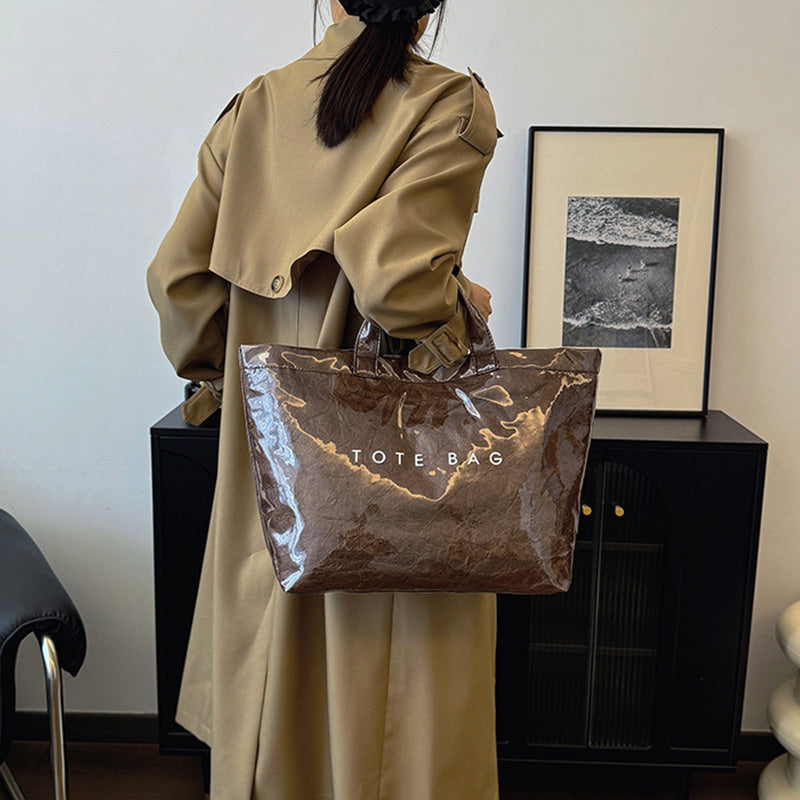 Women's retro letters print tote bag by Arenzza, featuring a stylish vintage design with bold letter patterns on durable fabric.