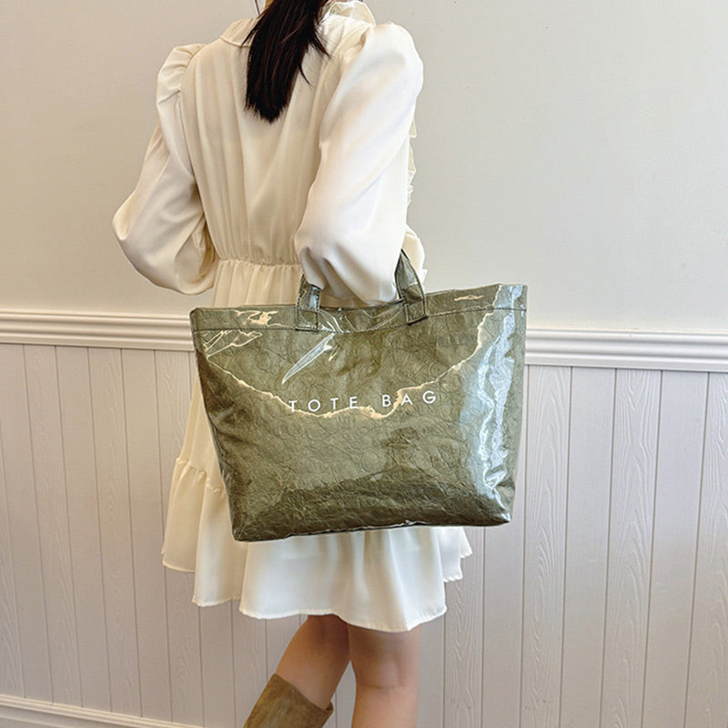 Women's retro letters print tote bag by Arenzza, featuring a stylish vintage design with bold letter graphics and sturdy handles.