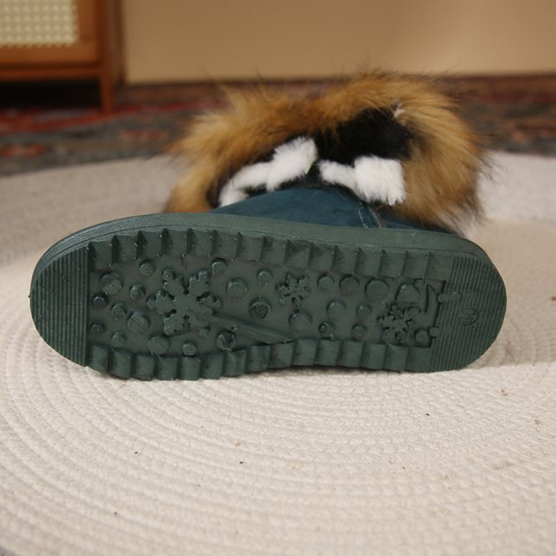 A pair of women's slip-on plush snow ankle booties by Arenzza, featuring soft material and cozy winter style.