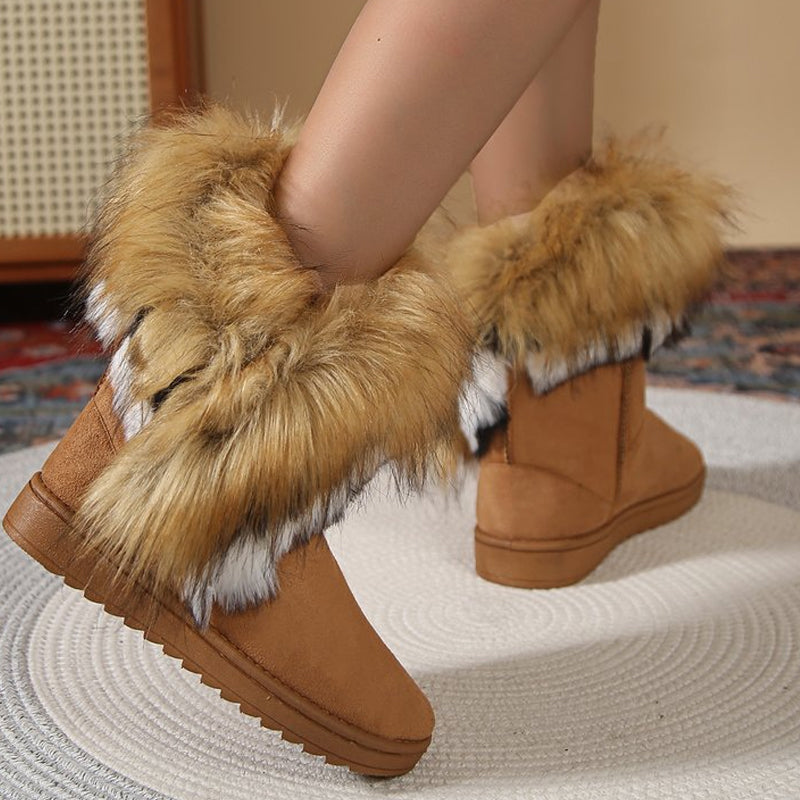 A pair of women's plush slip-on snow ankle booties by Arenzza featuring soft fabric and cozy winter style.