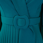 Aarenza elegant V-neck pleated dress with belt in a flowing fabric, displayed on a mannequin.