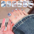 A set of 14 square press-on toenails by Arenzza displayed on a white background, showcasing their glossy finish and natural nail shape.