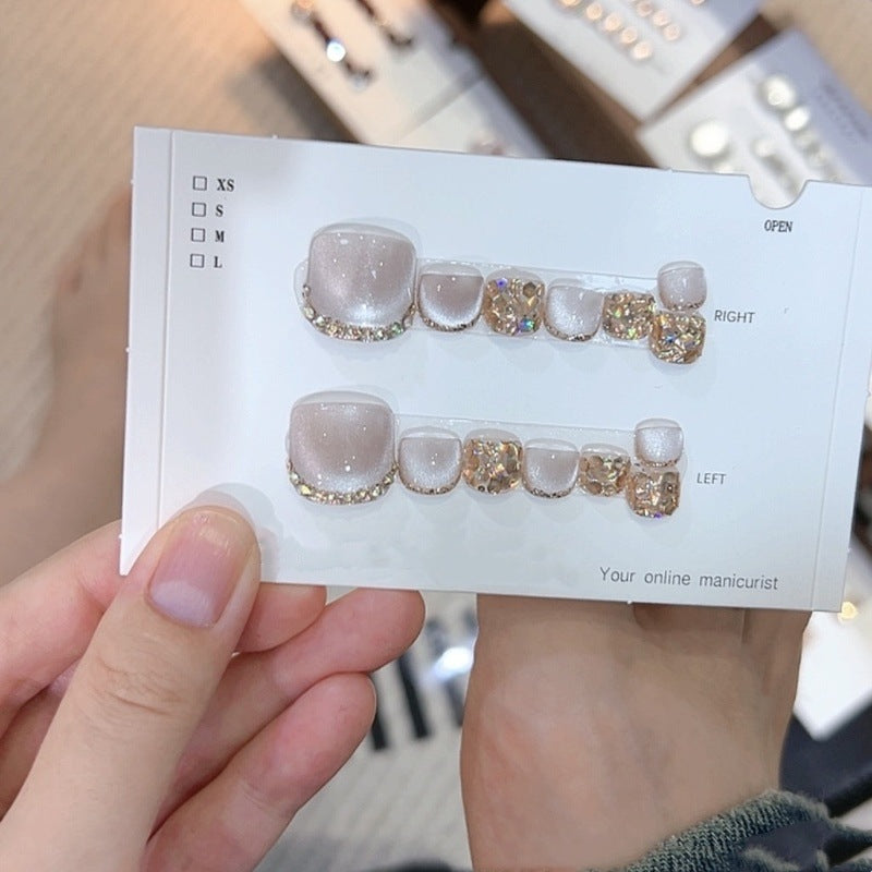 A set of 14 square press-on toenail sheets by Arenzza, showcasing neatly arranged cosmetic nail extensions on a white background.
