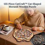 A wooden cat puzzle with 135 pieces from Arenzza's CatCraft™ collection, showing the assembled puzzle and scattered pieces.