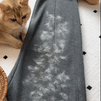 Aarenza PawPal™ Pet Cleaning Glove showing a hand wearing the glove, with soft bristles for grooming and cleaning pets' fur.