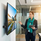 A person using Arenzza SmartConnect™ to connect a smartphone to a TV in a modern living room setting.